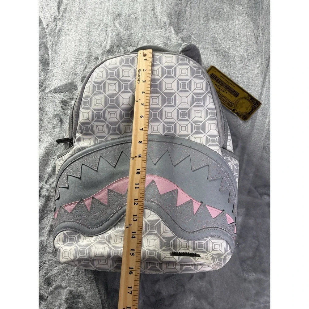 Sprayground A.I. African Intelligence DBX Sandflower Hiking Backpack Gray Pink